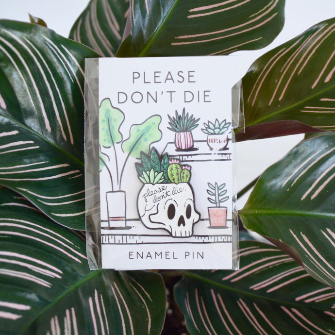 enamel pin with skull and plants