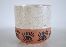 Load image into Gallery viewer, two tone plant pot with white speckles and orange base with painted eyes